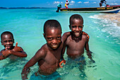 Children playing in the beach on Cayes-à-L’eau, a fishermen islet located northeast of Caye Grand Gosie, Île-à-Vache, Sud Province, Haiti