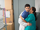 Doctor and Nurse Kissing in Supply Room