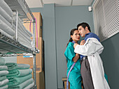Doctor and Nurse Kissing in Supply Room