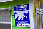 Antigua and Barbuda, West Indies, Island of Antigua. Tsunami hazard signs in downtown St John's.