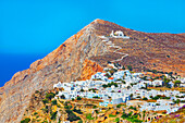 View of Chora village built on a cliff above the sea and Panagia Kimissis church, Chora, Folegandros Island, Cyclades Islands, Greek Islands, Greece, Europe