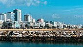 View of beach and promenade at Quarteira, Algarve, Portugal