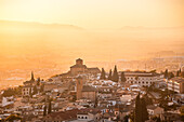 Atmospheric sunset above historic Albaicin and Iglesia de San Cristobal, UNESCO, viewed from San Miguel Alto, Albaicin, Granada, Andalucia, Spain