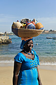 Woman selling basketry on a beach at Ngor island, Dakar, Senegal, West Africa