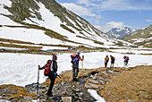 Trekkers along the Reno di Medel river, Val Piora, Canton Ticino, Switzerland