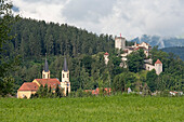 Brunico (Bruneck) Castle and Old Town with Church of the Assumption of Mary in foreground, Alto Adige, South Tyrol, Italy