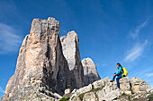 Hiker at the foot of the Tre Cime di Lavaredo (Three Peaks of Lavaredo), Three Peaks Nature Park, Dolomites, UNESCO, South Tyrol, Italy