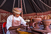 Salih potter, demonstrating his craft in the enclosure of the Fort of Nizwa, Ad Dakhiliyah Region, Sultanate of Oman, Arabian Peninsula