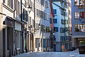 Man walking along street in Old Town, Zurich, Switzerland