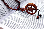 Islamic Holy Book Quran with rosary beads, Ramadan concept, Indonesia