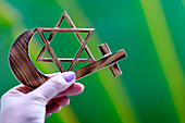 Religious symbols of interfaith dialogue concept, Jewish Star of David, Muslim Crescent, Christian Cross, Indonesia