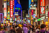 View of busy street and neon lights at night in Shibuya District, Kamiyamacho, Shibuya City, Tokyo, Honshu, Japan