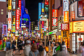 View of busy street and neon lights at night in Shibuya District, Kamiyamacho, Shibuya City, Tokyo, Honshu, Japan