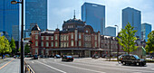 View of Tokyo Station and Chiyoda's Marunouchi business district backdrop on a sunny day, Chiyoda, Tokyo, Honshu, Japan