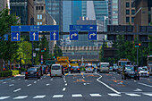 View of traffic on city street near Imperial Palace on a sunny day, Chiyoda, Tokyo, Honshu, Japan