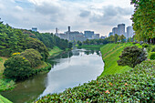 View of city buildings and Sakuradabori Moat of the Imperial Palace, Chiyoda, Tokyo, Honshu, Japan