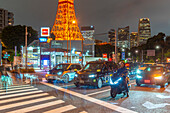 View of Tokyo Tower and city traffic at night, Minato City, Tokyo, Honshu, Japan