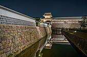 View of Gojikken Nagaya-Kanazawa Castle reflecting in moat at dusk, Kanazawa City, Ishikawa Prefecture, Honshu, Japan