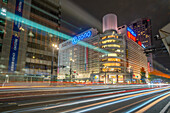 View of street scene, trail lights and shopping mall in Hiroshima at night, Hiroshima, Honshu, Japan