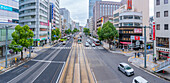 Elevated view of traffic and tram on major street during daytime, Hondori, Naka Ward, Hiroshima, Honshu, Japan