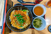 View of traditional Japanese dish of rice and scrambled egg, Miyajimacho, Hatsukaichi, Hiroshima, Honshu, Japan