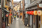 View of narrow street with Japanese lanterns in Nakagyo Ward, Nabeyacho, Kyoto, Honshu, Japan