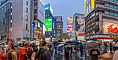 View of colourful adverts in Dotonbori, vibrant entertainment district near the river at dusk, Osaka, Honshu, Japan