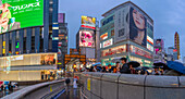 View of colourful adverts in Dotonbori, vibrant entertainment district near the river at dusk, Osaka, Honshu, Japan