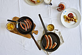 Duck sausage with apple chutney, curried veal sausage, coarse bratwurst with pear mustard