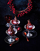 Vegan hibiscus pear with red wine mousse and chocolate sauce