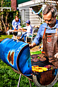 Barbecue with corn on the cob and burger patties