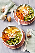 Chicken soup with vegetables and egg