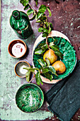 Fresh fruit and berries in bowls on a rustic base