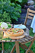 Chanterelle and cauliflower quiche served in the garden