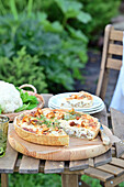Chanterelle and cauliflower quiche served in the garden