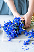 Fresh cornflowers on a chopping board
