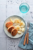 Salmon and carrot patties with cauliflower