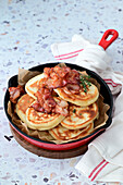 Cheese pancakes with bacon and honey
