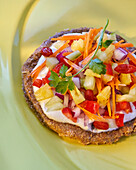 Vegetarian raw food pizza with pineapple and cashew butter