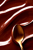 Melted chocolate coating with spoon