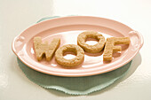 Homemade dog biscuits in the shape of letters