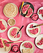 Pita bread with beetroot spread and sesame seeds