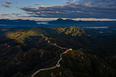 Aerial view of the majestic Jinshanling Great Wall amidst rugged mountains and tranquil clouds,Chengde,China