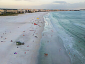Aerial view of beautiful Siesta Key beach with colorful lifeguard houses and people enjoying the sandy shore,Florida,United States