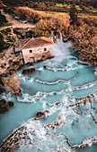 Aerial view of geothermal Therme di Saturnia with cascading waterfall and turquoise water,Tuscany,Italy