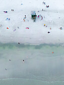 Aerial view of colorful lifeguard house and people on the sandy beach by the Gulf of Mexico,Siesta Key,United States