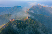 Aerial view of jinshanling great wall amidst majestic mountains and serene forests with clouds,Luanping County,China
