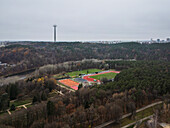 Aerial view of Vingio park with TV tower surrounded by forest and sports field in autumn,Vilnius,Lithuania