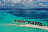 Aerial view of bungalows of a luxury resort along Moofushi Reef,Alif Alif Atoll,Maldives archipelagos