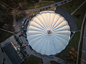 Aerial view of indoor snowcenter with unique dome structure and surrounding greenery,Elektrenai,Lithuania